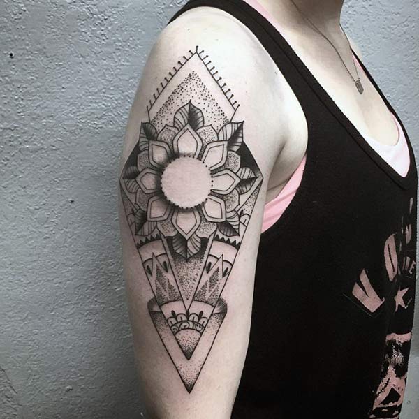 Geometric tattoo for Women with a black ink design make them look charming