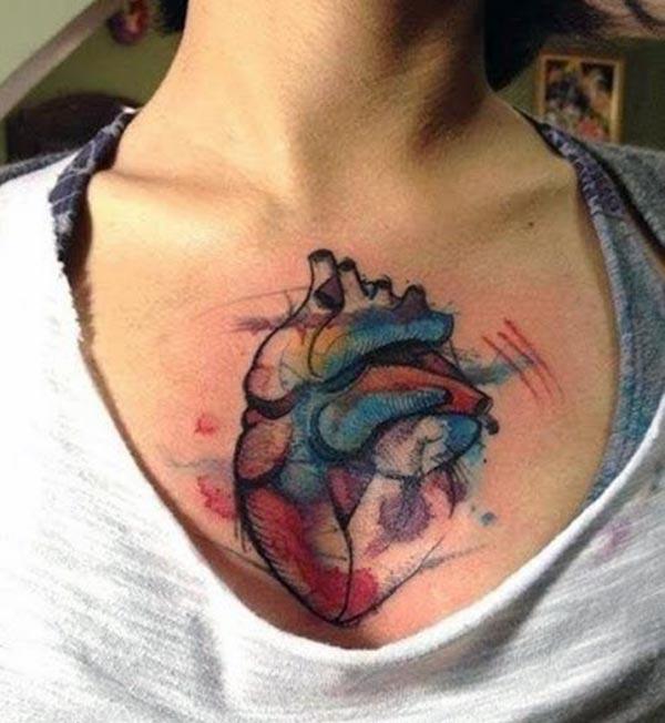 Heart Tattoo with a blue ink design makes a girl look elegant