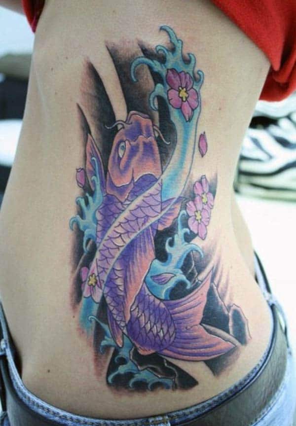 Koi Fish Tattoo for Women with a blue ink gives them the pretty and attractive appearance