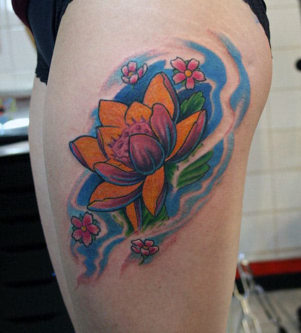 Lotus Flower tattoo on the side thigh gives the girls an attractive look