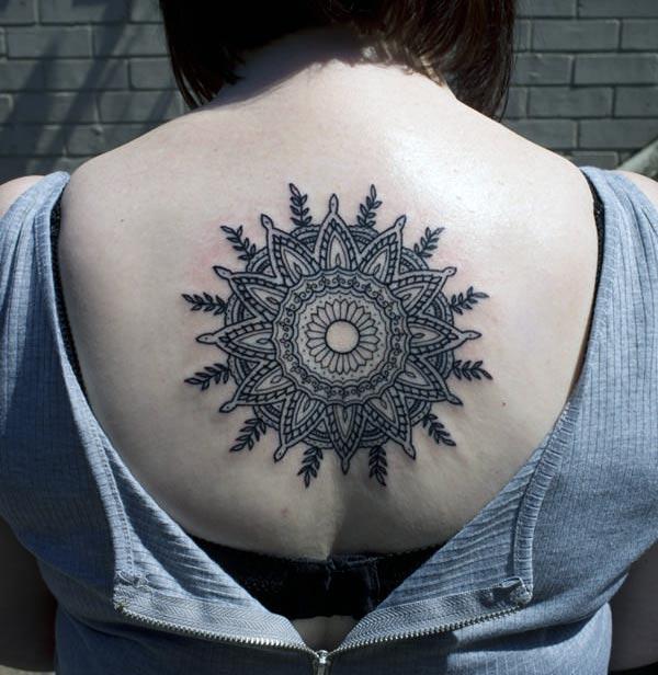 Mandala tattoo on the back make a lady look captivating