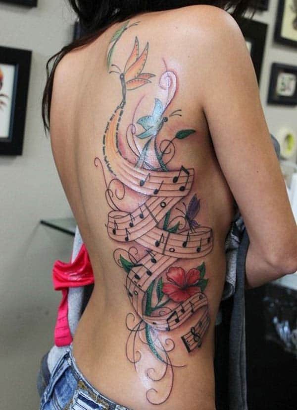 Music Tattoo with a brown and pink ink design make a girl look cool