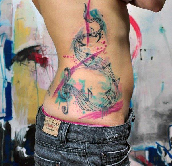 Music Tattoo for Women with pink and blue ink design make them look attractive