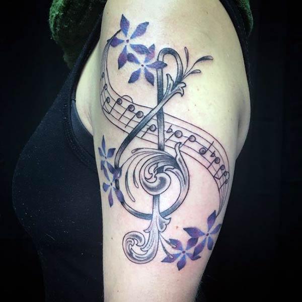 Music Tattoo for Women with black ink design make them look attractive