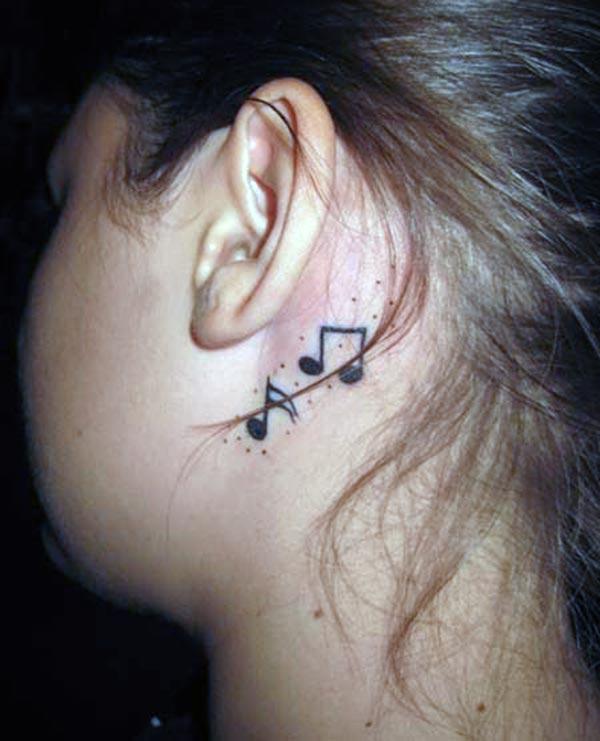 Music Tattoo behind the ear brings the feminist look