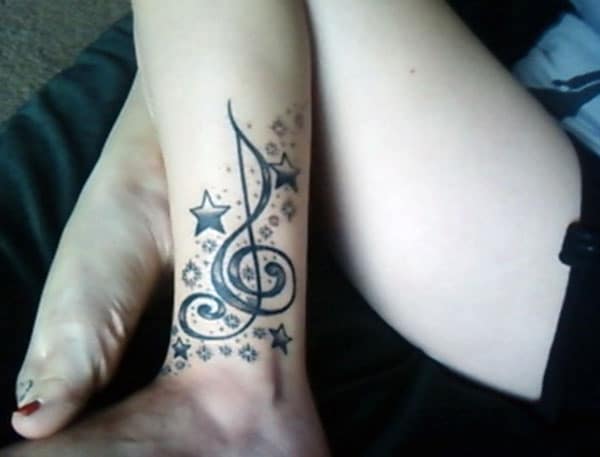 Music Tattoo with a black ink design make a girl look stylish