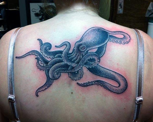 Octopus Tattoo on the back makes a woman look captivating