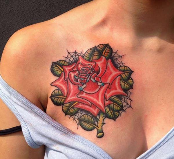 Rose Tattoo with pink ink design on the upper chest brings a gorgeous look