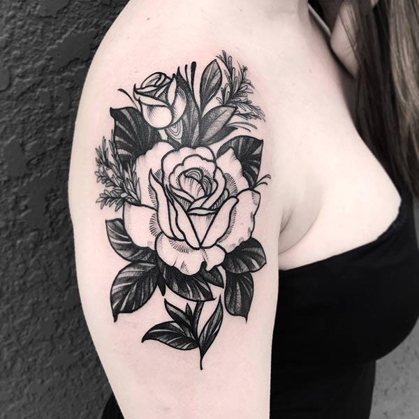 The Rose Tattoo on the shoulder with a black ink design that make a lady look gorgeous