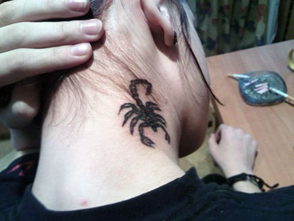 The Scorpion Tattoo on the side neck of a girl make her look captivating