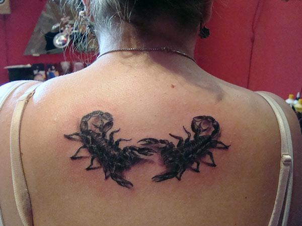 Scorpion Tattoo on the back of a lady makes her to look attractive