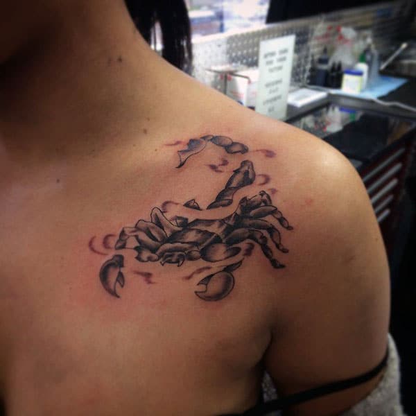 Scorpion Tattoo on the upper chest makes a women look attractive