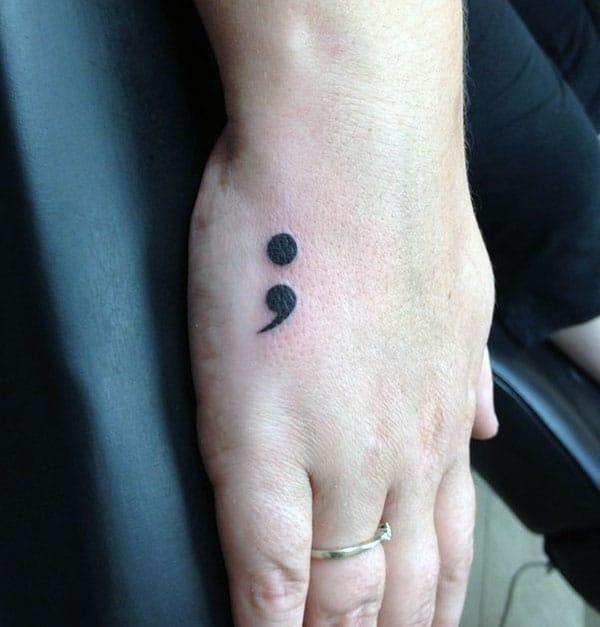 Semicolon tattoo on the hand brings the captivating look