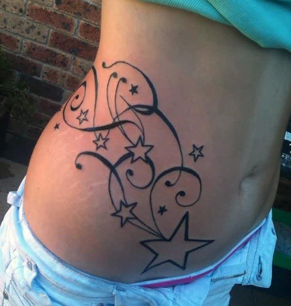 Star Tattoo on a girl side make her look attractive