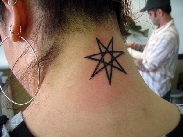 Star Tattoo on the back neck makes a woman look captivating