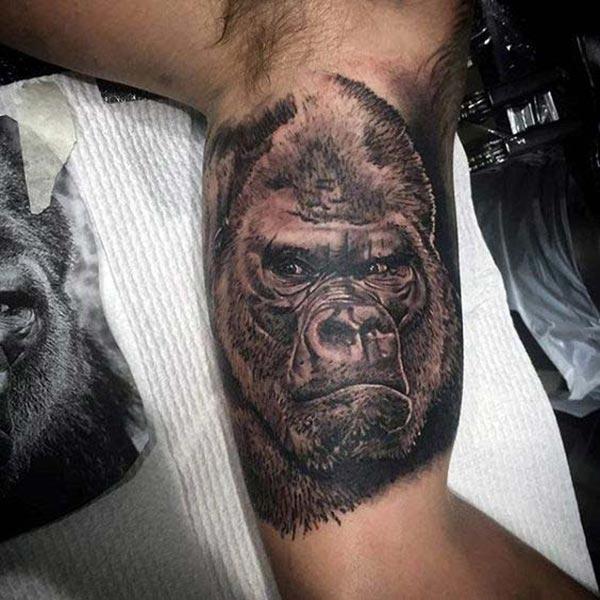 Bicep Tattoo for men with dark ink design makes a man look cute