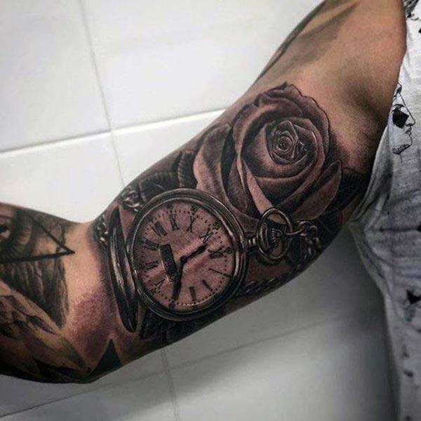 Bicep Tattoo for men with a flower ink design makes them look marvelous