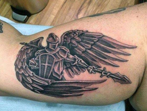 Bicep Tattoo for men with a wing ink design bring comely look