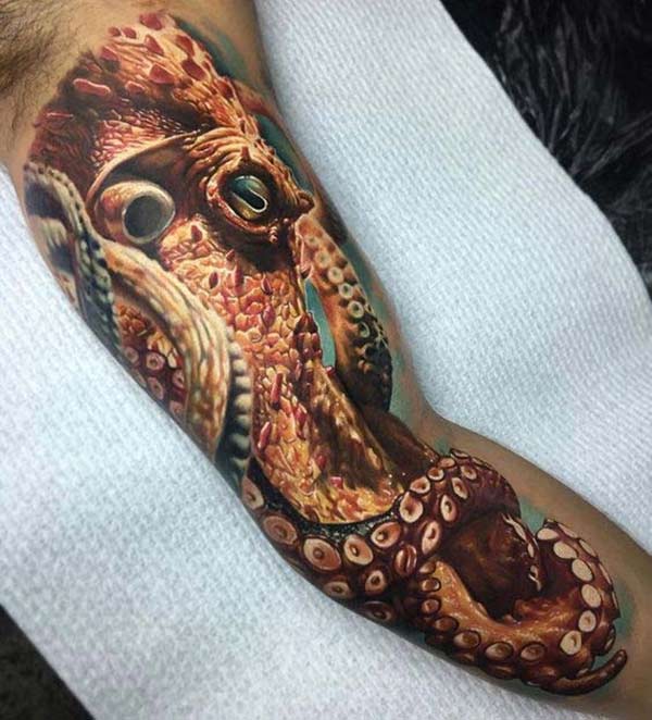 Bicep Tattoo for men with a brown ink design make them look stunning