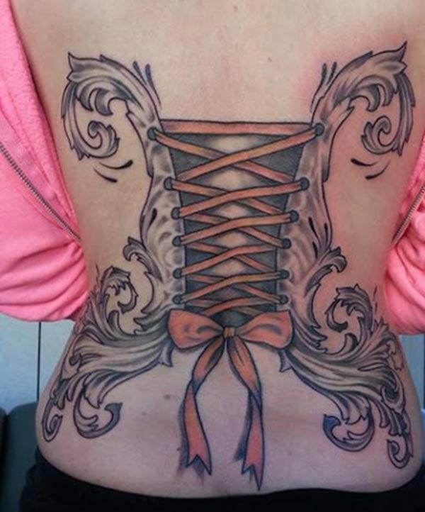 Bow tattoo on the back abdomen make a lady look captivating