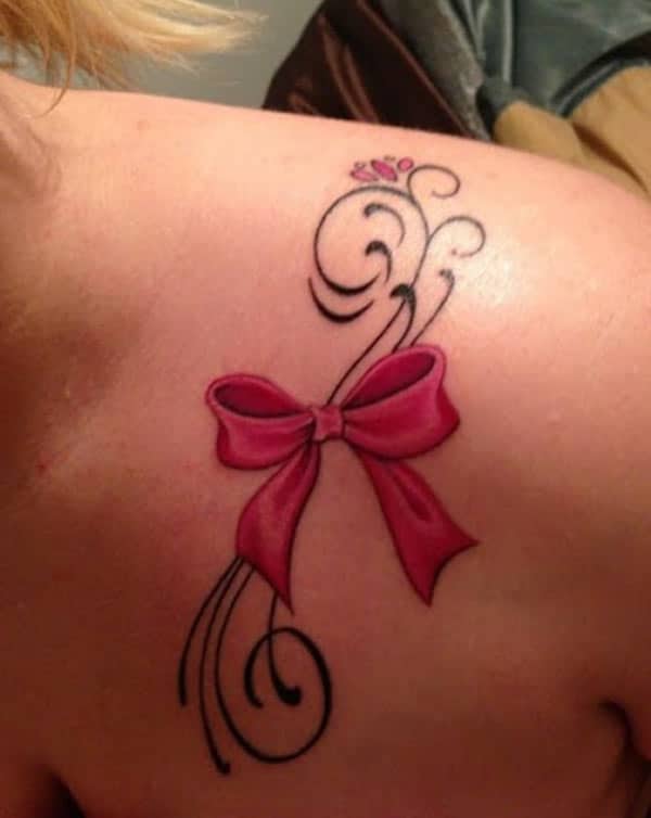 The violet design in of the bow tattoo on the upper shoulder, make girls have splendid look