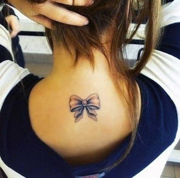 The violet design in of the bow tattoo on the back neck, make girls have splendid look