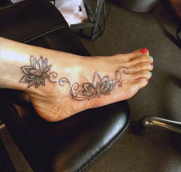 Foot tattoo on the leg makes a girl appear radiant
