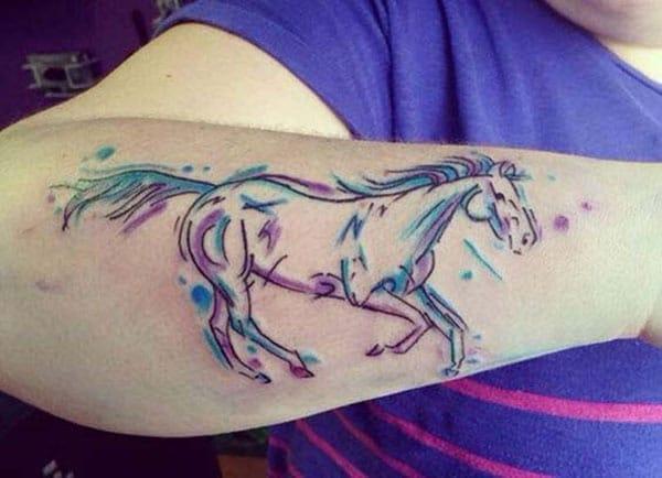 Horse tattoo with blue ink design make a girl look stylish