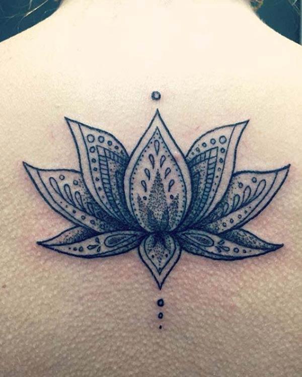 Lotus Flower tattoo on the back make a girl look elegant