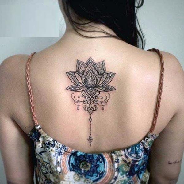 Lotus Flower tattoo on the back make a girl look cool