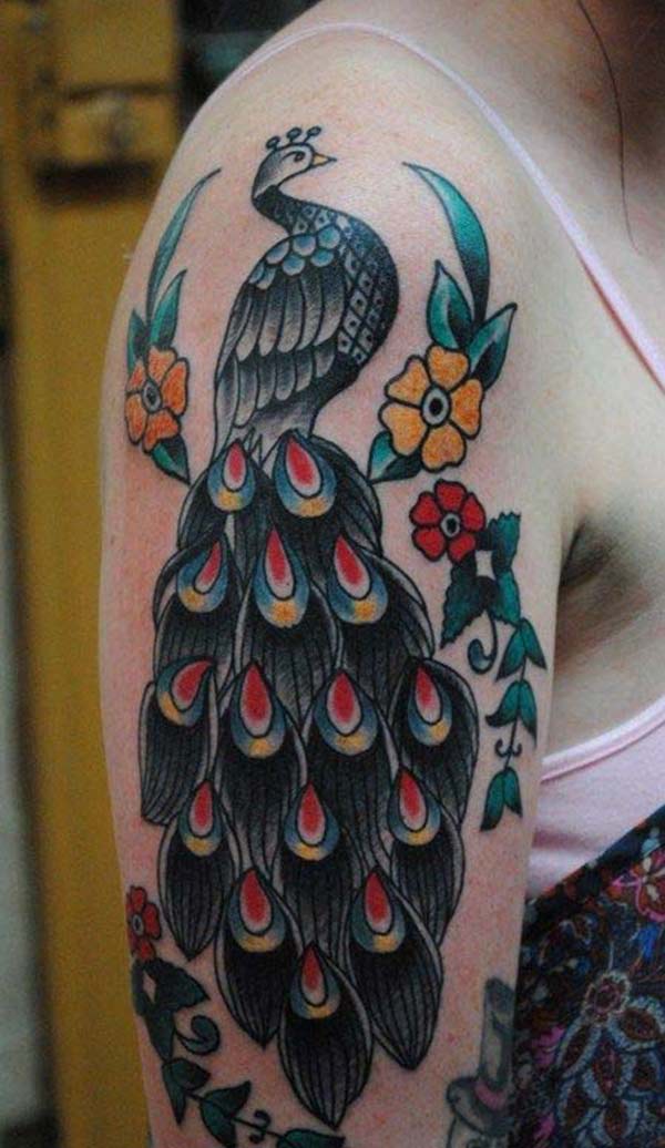 Peacock Tattoo on the shoulder makes a woman look exquisite