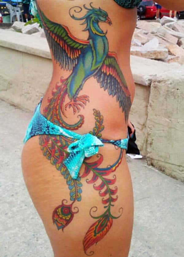 Phoenix tattoo on the side makes a woman look captivating