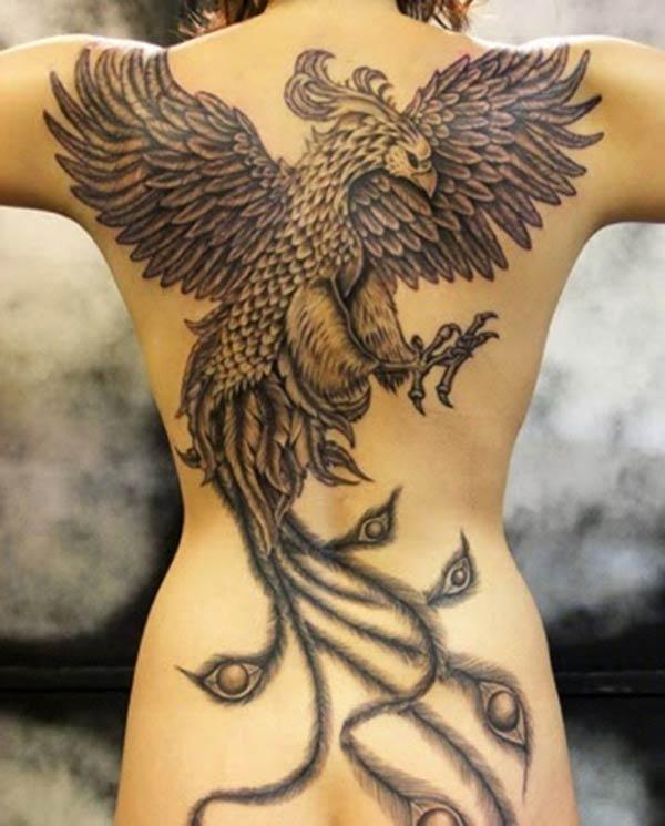Phoenix tattoo on the back makes a women look attractive 