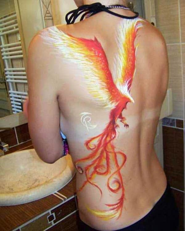 Phoenix tattoo for the side back gives the captive look in girls