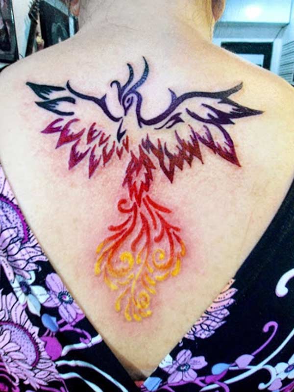 Phoenix tattoo with a pink ink design makes a girl look cute