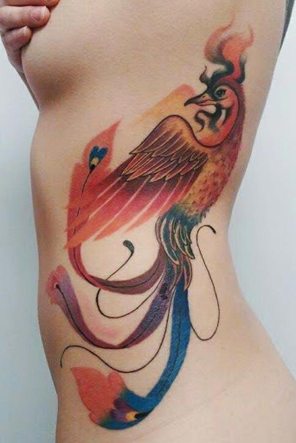Phoenix tattoo on the back makes a girl alluring 
