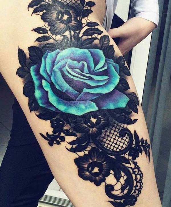 Rose tattoo on the side thigh gives the girls look sexy and captivating
