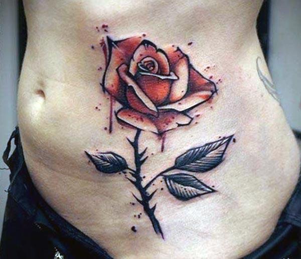 Brown ink design of the Rose tattoo on the side belly of ladies make them look attractive