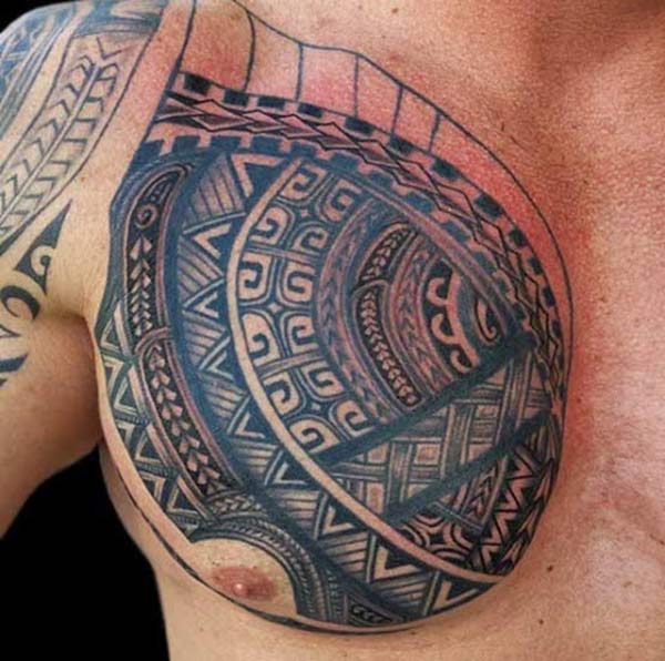 Tribal tattoo on the upper chest makes a man have a hunky look