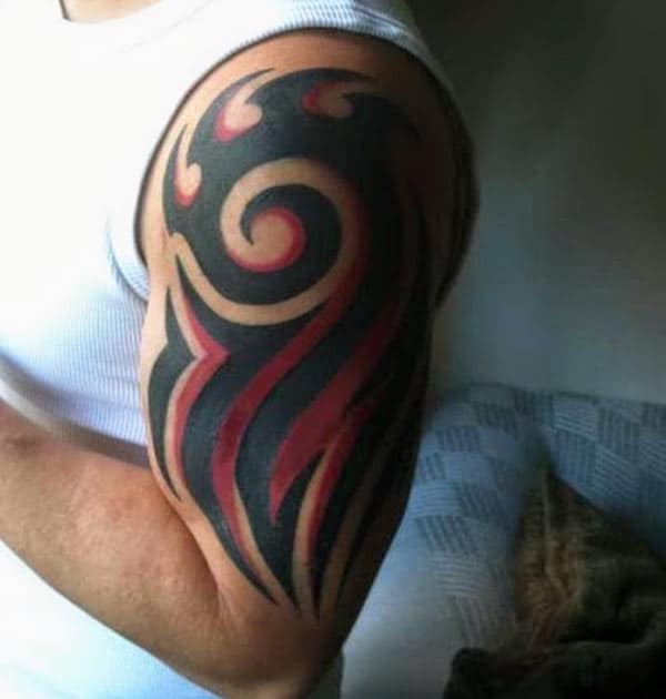 Tribal tattoo on the left shoulder makes men appear stately