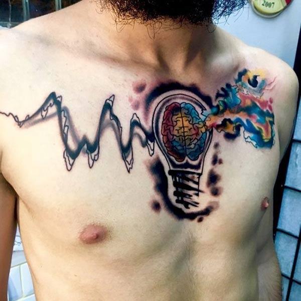 Vivid brain in bulb watercolor chest tattoo ideas for adventure seeking mens