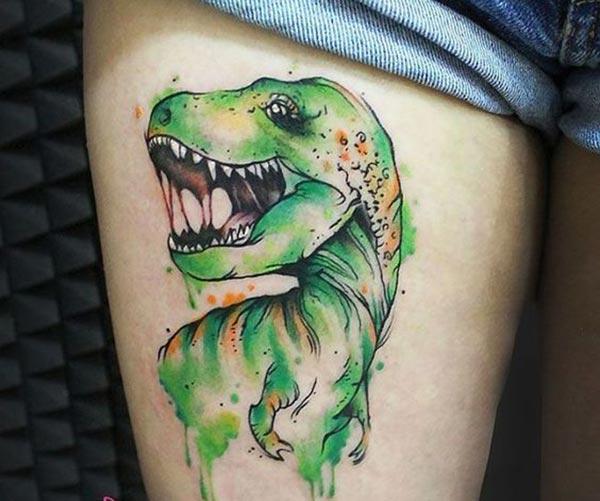 Funky Green Dinosaur watercolor thigh tattoo ideas for Hippy Girls