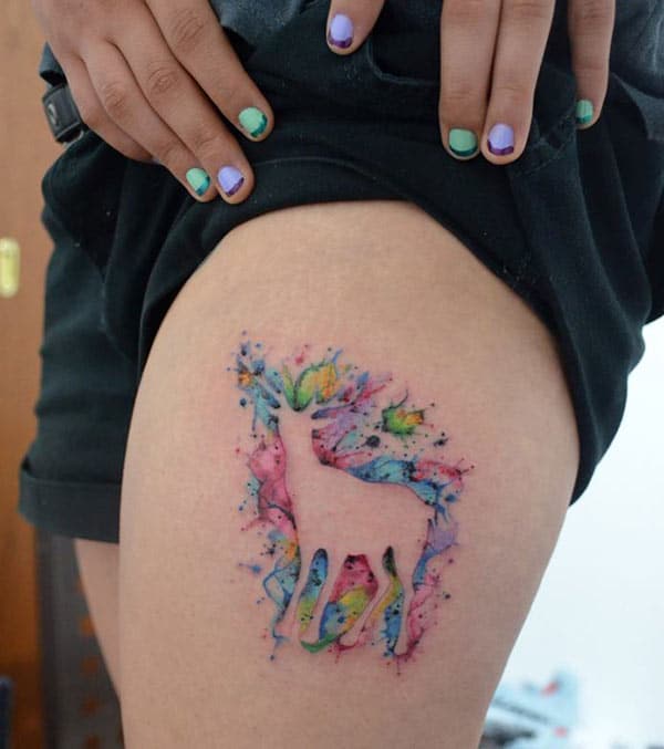 Magical Multi-hued deer watercolor tattoo ideas on thigh for Ladies