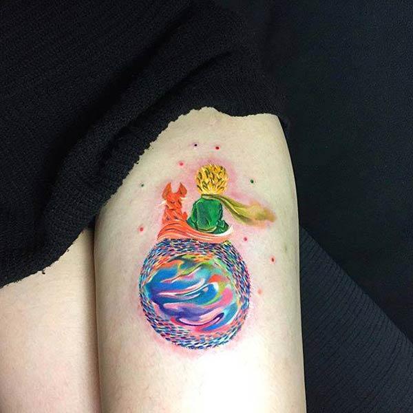 Girl’s Appealing watercolor thigh tattoo of boy and fox enjoying night sky