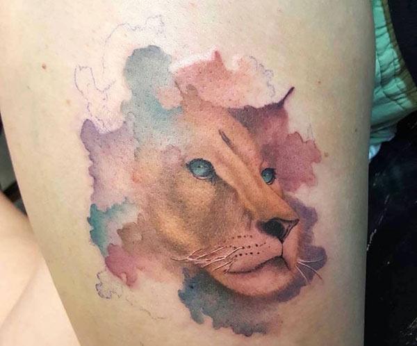 Realistic lion face watercolor thigh tattoo ideas for Girls