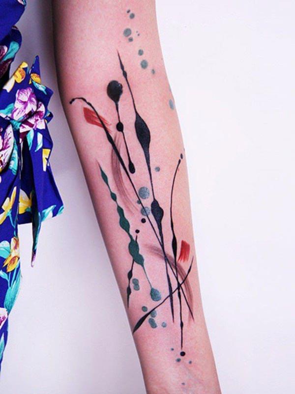 Chic-ish watercolor tattoo designs on arm for girls