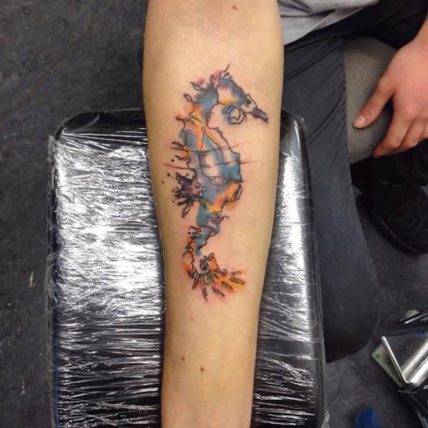 Radiant and funky Sea horse Water color Ink Arm tattoo ideas for boys and men