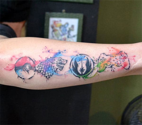 Trendy and striking Water color ink Arm tattoo ideas for gamer boys