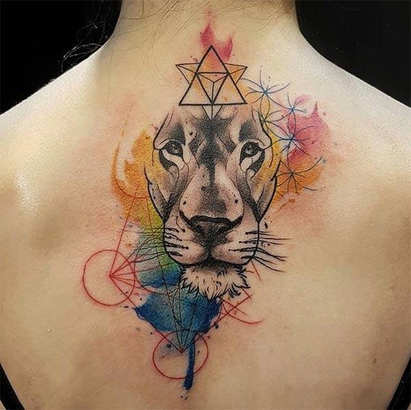 Gracefully glaring lion face watercolor back tattoo ideas for women