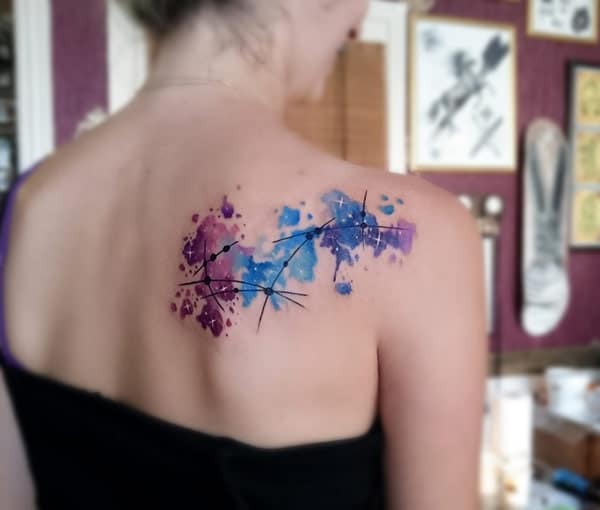 Polychromatic continental map galaxy watercolor tattoo ink ideas on back shoulder for ladies